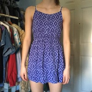Purple buttoned up dress.